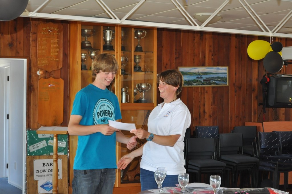 Thure Gnadenberg receiving his prize for cramming himself into a Europe Dinghy - HARKEN Labour Weekend Regatta 2010 © Rosie Reid